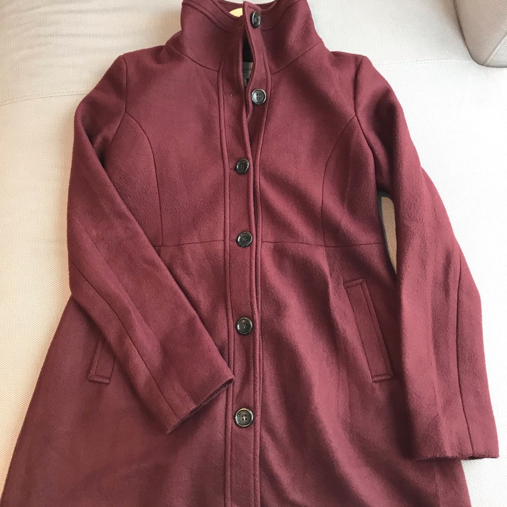 Burgundy coat.
